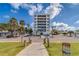 Modern beachfront building with ample parking and a convenient walkway at 18320 Gulf Blvd # 303, Redington Shores, FL 33708