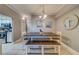 Bright dining area with a square table and bench seating at 18320 Gulf Blvd # 303, Redington Shores, FL 33708