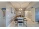 Bright dining room with a farmhouse table and bench seating at 18320 Gulf Blvd # 303, Redington Shores, FL 33708