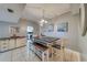 Coastal-themed dining area with farmhouse table and bench seating at 18320 Gulf Blvd # 303, Redington Shores, FL 33708