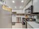 Modern kitchen featuring stainless steel appliances and white cabinets at 18320 Gulf Blvd # 303, Redington Shores, FL 33708