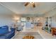 Bright living room with comfy seating, large TV, and ocean views at 18320 Gulf Blvd # 303, Redington Shores, FL 33708