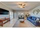 Relaxing living room with comfortable seating and a large TV at 18320 Gulf Blvd # 303, Redington Shores, FL 33708