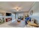 Spacious living room with comfortable seating, a large TV, and plenty of natural light at 18320 Gulf Blvd # 303, Redington Shores, FL 33708