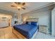 Main bedroom with a king-size bed and ensuite bathroom at 18320 Gulf Blvd # 303, Redington Shores, FL 33708