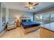 Main bedroom with a king-size bed and access to a balcony at 18320 Gulf Blvd # 303, Redington Shores, FL 33708