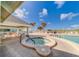 Relaxing pool and spa area with comfortable lounge chairs and a covered patio at 18320 Gulf Blvd # 303, Redington Shores, FL 33708