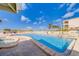 Refreshing swimming pool with plenty of lounge chairs for sunbathing at 18320 Gulf Blvd # 303, Redington Shores, FL 33708