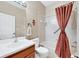 Clean bathroom with tub/shower combo, updated vanity, and tiled walls at 225 Mystic Falls Dr, Apollo Beach, FL 33572