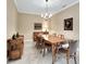 Formal dining room with wood furniture, chandelier, and elegant decor at 225 Mystic Falls Dr, Apollo Beach, FL 33572