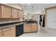 Modern kitchen features granite countertops and stainless steel appliances at 225 Mystic Falls Dr, Apollo Beach, FL 33572
