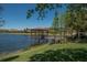 Serene lake view with a gazebo and dock at 225 Mystic Falls Dr, Apollo Beach, FL 33572