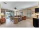 Spacious living room with tile floors, neutral color palette, and ample natural light at 225 Mystic Falls Dr, Apollo Beach, FL 33572