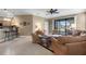 Open living room and kitchen with tile floors and neutral tones at 225 Mystic Falls Dr, Apollo Beach, FL 33572