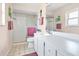 Clean and bright bathroom with a shower, white vanity, and tiled flooring at 2465 Northside Dr # 1808, Clearwater, FL 33761