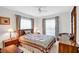 Bedroom with carpeted floors, two large windows, and matching nightstands at 2465 Northside Dr # 1808, Clearwater, FL 33761