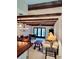 Dining room and sitting area with exposed ceiling beams at 2465 Northside Dr # 1808, Clearwater, FL 33761