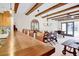 Dining area with a long wooden table, leather chairs, and wood beam ceiling at 2465 Northside Dr # 1808, Clearwater, FL 33761