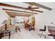 Spacious sitting and dining area with exposed beams and ceiling fan at 2465 Northside Dr # 1808, Clearwater, FL 33761
