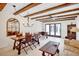 Dining room and sitting area with exposed beams and french doors at 2465 Northside Dr # 1808, Clearwater, FL 33761