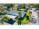 Exterior elevation of a unit with a carport and tropical landscaping at 2465 Northside Dr # 1808, Clearwater, FL 33761