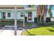 Light blue home with a covered carport and landscaped yard at 2465 Northside Dr # 1808, Clearwater, FL 33761