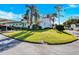 View of the home's exterior, showcasing its corner lot location and lush lawn at 2465 Northside Dr # 1808, Clearwater, FL 33761