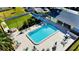 Aerial view of the community pool with ample seating and a nearby putting green at 2465 Northside Dr # 1808, Clearwater, FL 33761