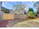 Backyard featuring a wood fence with an adjacent grassy area at 2529 Clareside Dr, Valrico, FL 33596