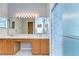 Bright bathroom featuring double sinks, vanity, a glass enclosed shower, and modern lighting at 2529 Clareside Dr, Valrico, FL 33596