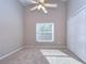 Cozy carpeted bedroom with ceiling fan and closet at 2529 Clareside Dr, Valrico, FL 33596