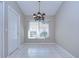 Dining room featuring light neutral walls, tile floors, and modern lighting at 2529 Clareside Dr, Valrico, FL 33596