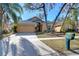 Charming single-Gathering home featuring a driveway and a well-manicured lawn at 2529 Clareside Dr, Valrico, FL 33596