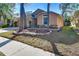 Well-maintained single-story home with a landscaped front yard and mulch at 2529 Clareside Dr, Valrico, FL 33596