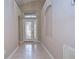 Bright foyer with decorative glass front door and tile flooring at 2529 Clareside Dr, Valrico, FL 33596