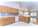 Modern kitchen featuring white cabinets, granite countertops, and stainless steel appliances at 2529 Clareside Dr, Valrico, FL 33596