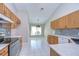 Well-lit kitchen featuring updated appliances, solid countertops, and backsplash at 2529 Clareside Dr, Valrico, FL 33596