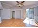 Vaulted living room featuring wood floors, archways, and natural light from sliding glass doors at 2529 Clareside Dr, Valrico, FL 33596