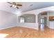 Open-concept living area with hardwood floors and seamless transition to the dining area at 2529 Clareside Dr, Valrico, FL 33596