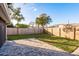 Spacious backyard with a patio and wooden privacy fence at 2713 Apia Pl, Holiday, FL 34691