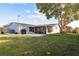 House exterior, fenced backyard, patio at 2713 Apia Pl, Holiday, FL 34691