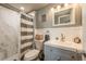 Clean bathroom, marble shower, gray vanity at 2713 Apia Pl, Holiday, FL 34691