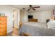 Bright bedroom with wood dresser and ceiling fan at 2713 Apia Pl, Holiday, FL 34691