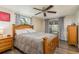 Cozy bedroom with wooden bed frame and access to backyard at 2713 Apia Pl, Holiday, FL 34691