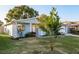 Cute one-story house with a welcoming front yard and lush landscaping at 2713 Apia Pl, Holiday, FL 34691