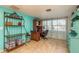 Bright home office features built-in shelving and a large desk at 2713 Apia Pl, Holiday, FL 34691