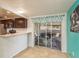 Updated kitchen with sliding doors leading to a patio area at 2713 Apia Pl, Holiday, FL 34691