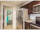 Modern kitchen with stainless steel appliances and granite countertops at 2713 Apia Pl, Holiday, FL 34691