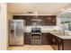 Modern kitchen with stainless steel appliances and granite countertops at 2713 Apia Pl, Holiday, FL 34691