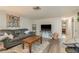 Cozy living room featuring a comfy sofa and a wooden coffee table at 2713 Apia Pl, Holiday, FL 34691